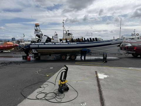 rib boat being cleaned on land
