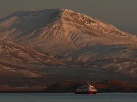 Hafsúlan whale watching boat with incredible snowy mountainous backdrop