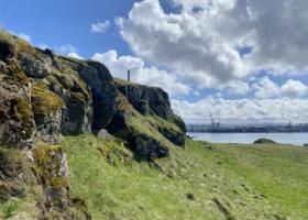 viðey island cliff during a half cloudy day