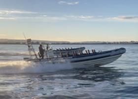 rib boats being sailed into storage