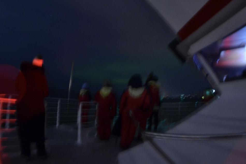 northern lights cruise and passengers on boat