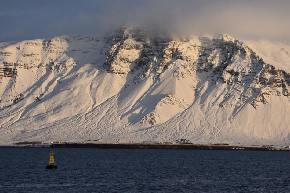 snowy mountain and moody weather