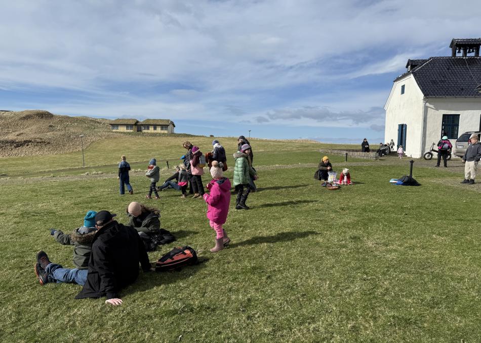 people enjoying the weather on viðey island