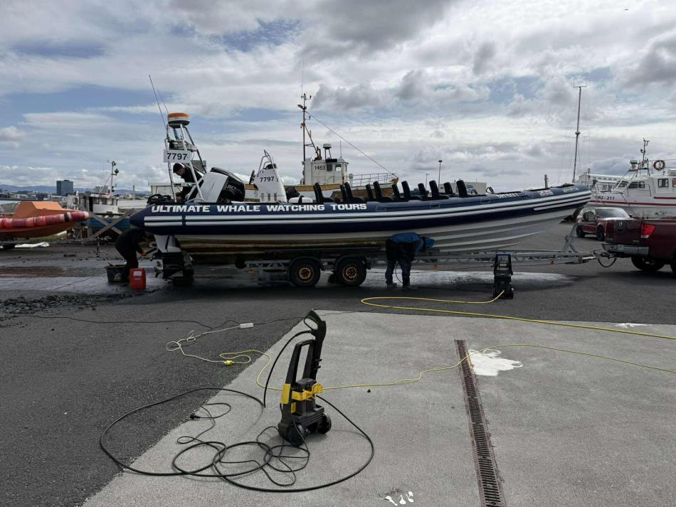 rib boat being cleaned on land