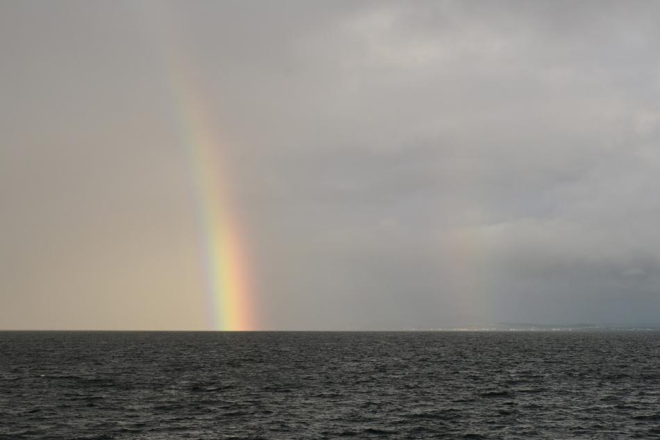 double rainbow over a stormy sea