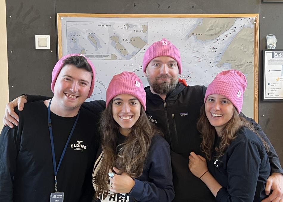 crew wears pink hats to support breastcancer survivors