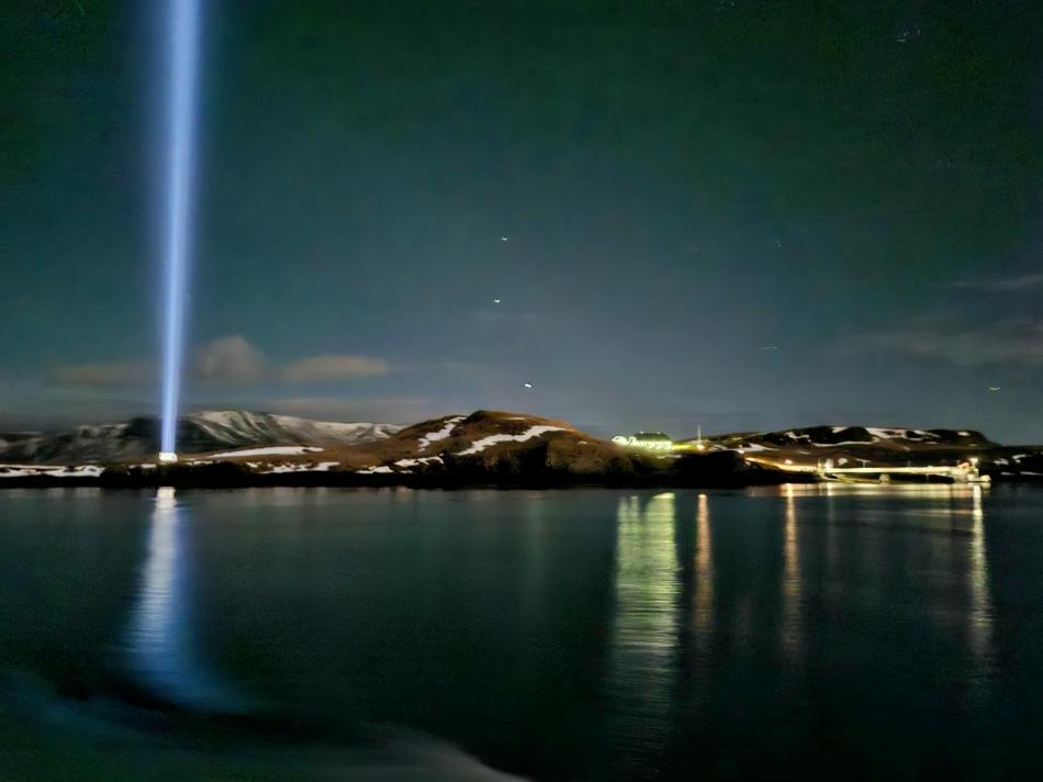 northern lights cruise overlooking the imagine peace tower