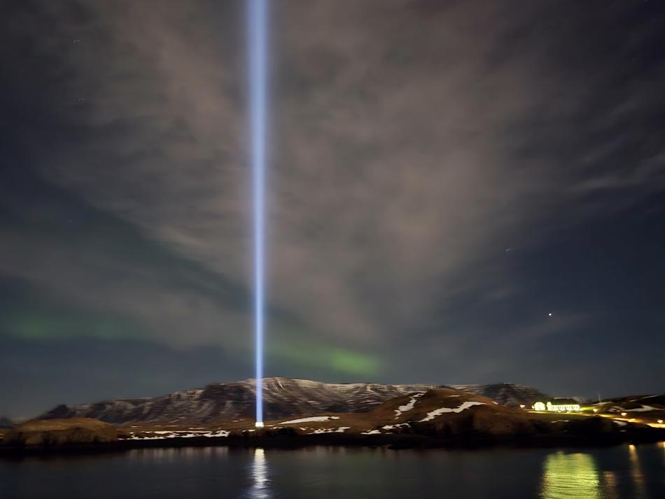 northern lights and imagine peace tower over mt. Esja