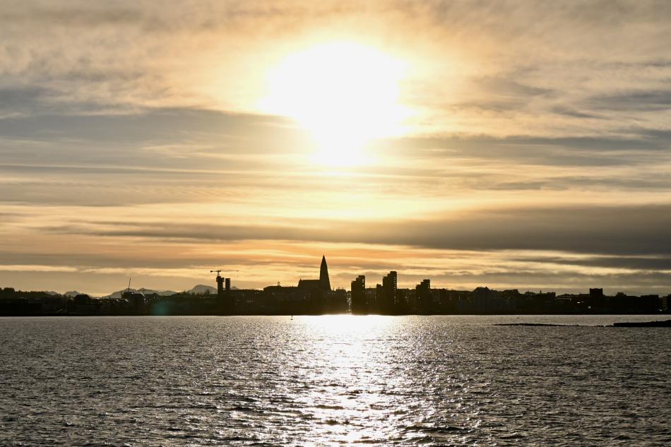 sun sets high over reykjavik during winter