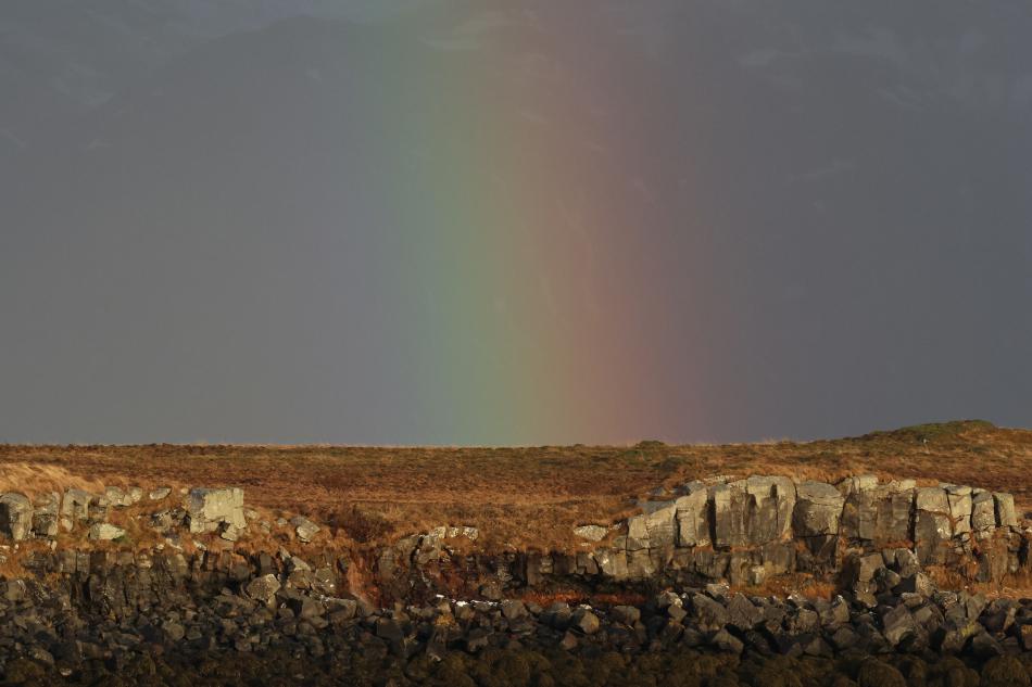 rainbow near cliff