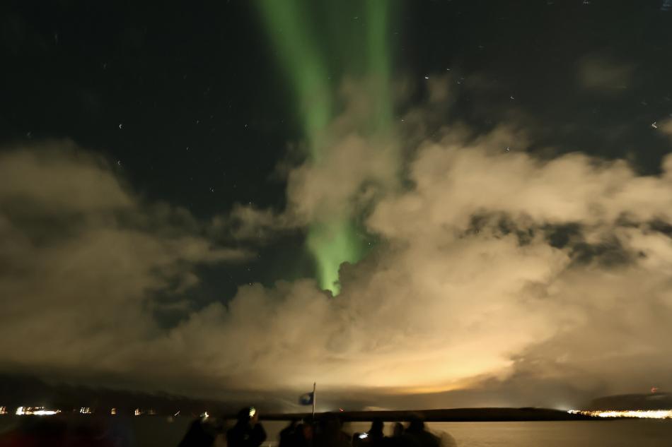 northern lights cruise through clouds
