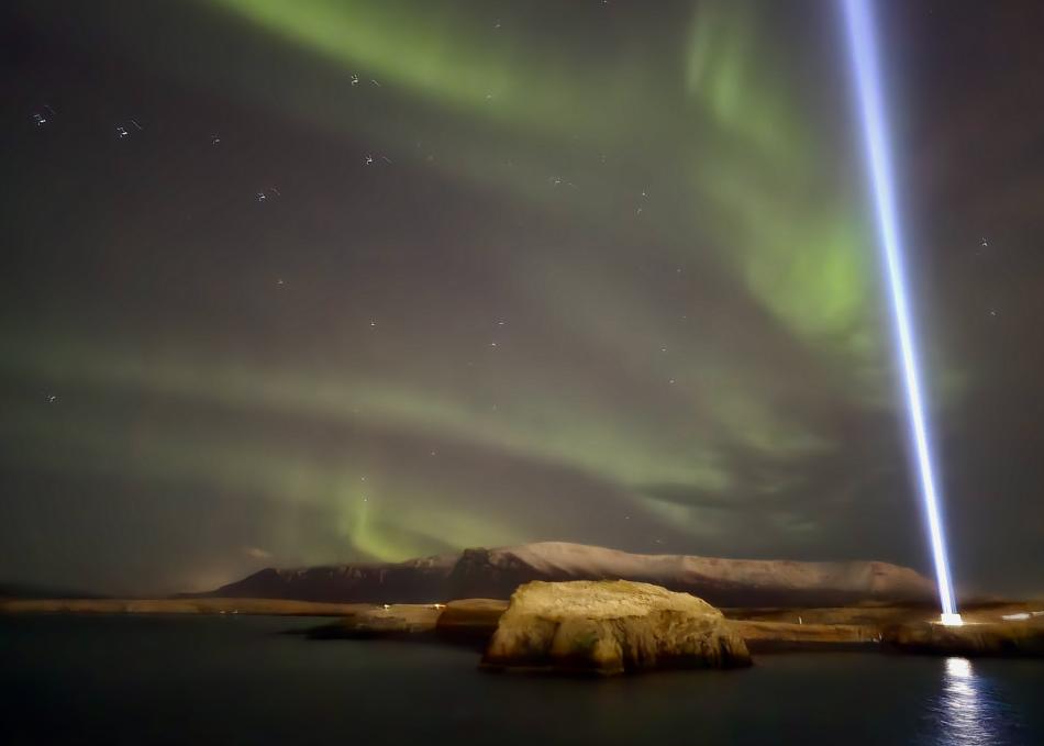 northern lights cruise with the beam of the imagine peace tower