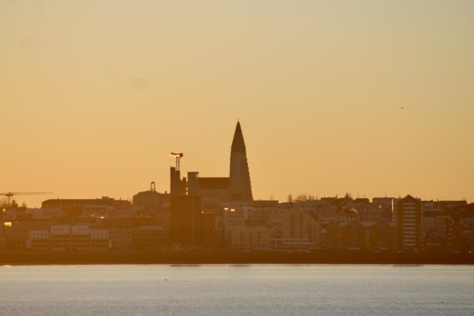 hallgrimskirkja as seen from the winter sun at sea